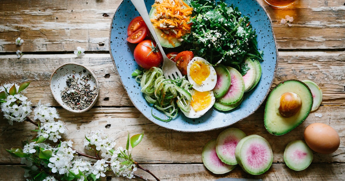 Nutritious bowl of vegetables, eggs and avocado representing whole-body wellness during perimenopause
