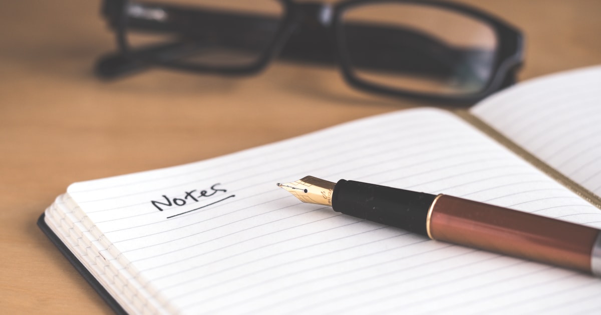 Open notebook with the word Notes written in ink, representing tracking the early signs of perimenopause